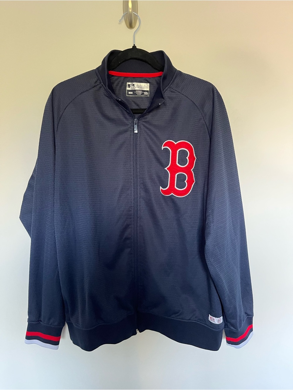 Genuine Merchandise Navy Jacket with Red Logo Accent
